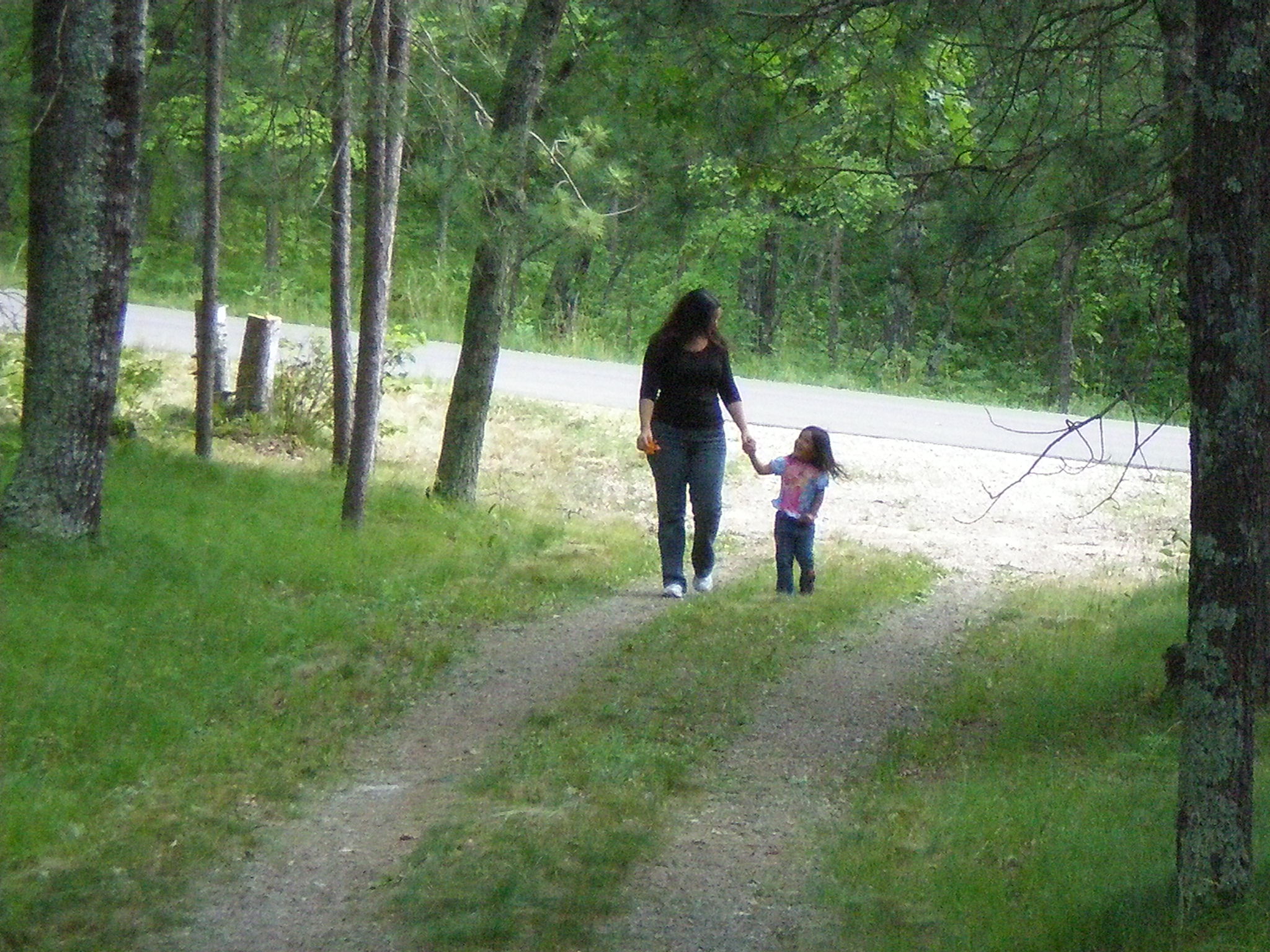 Meztli walking back from road with her Mom